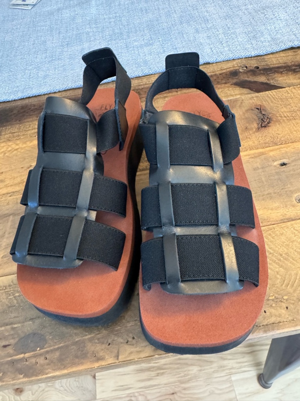 Fly London Black Strappy Sandals with Brown Footbed